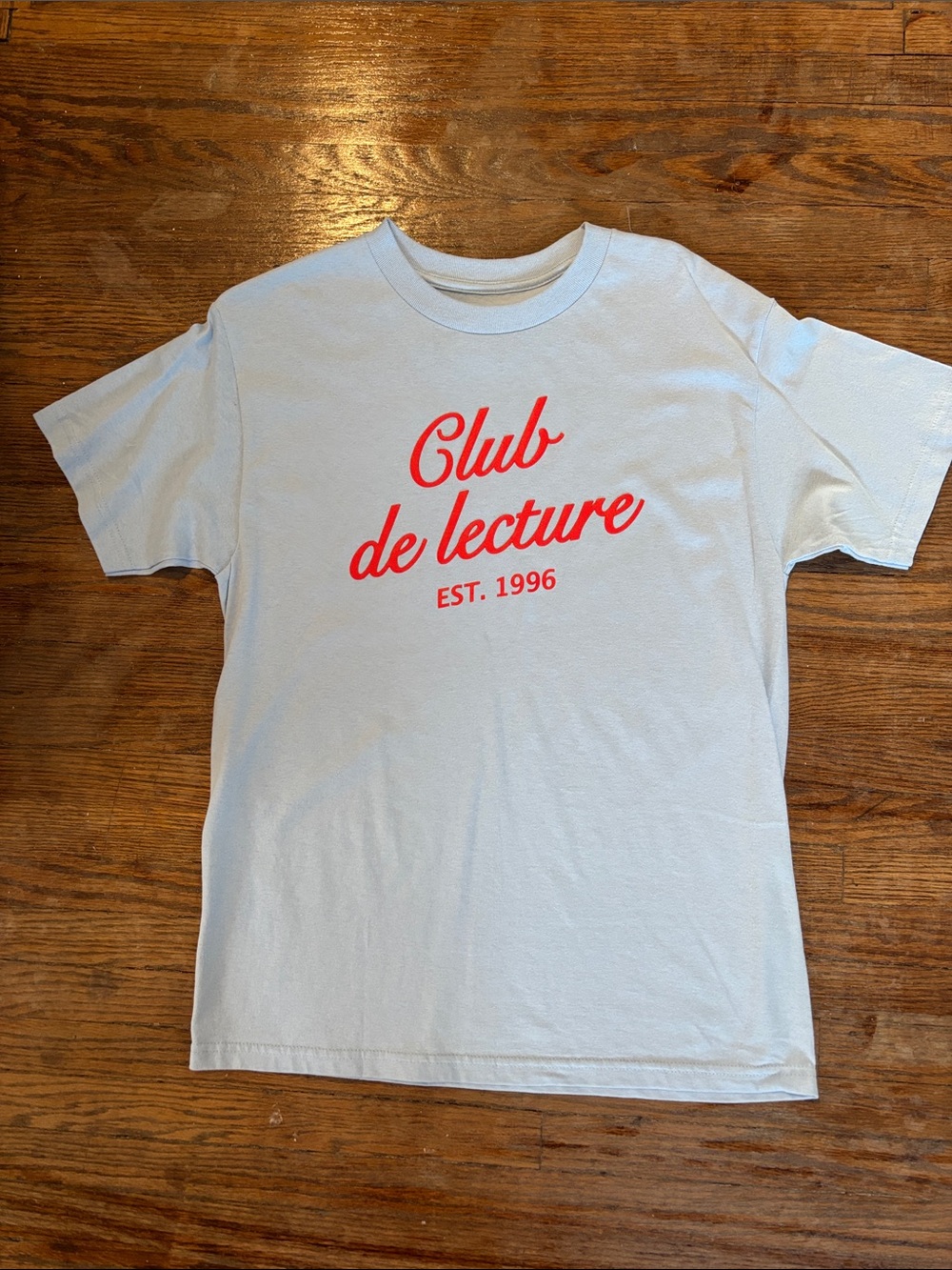 Indigo Club de Lecture Light Blue Graphic Tee with Red Script